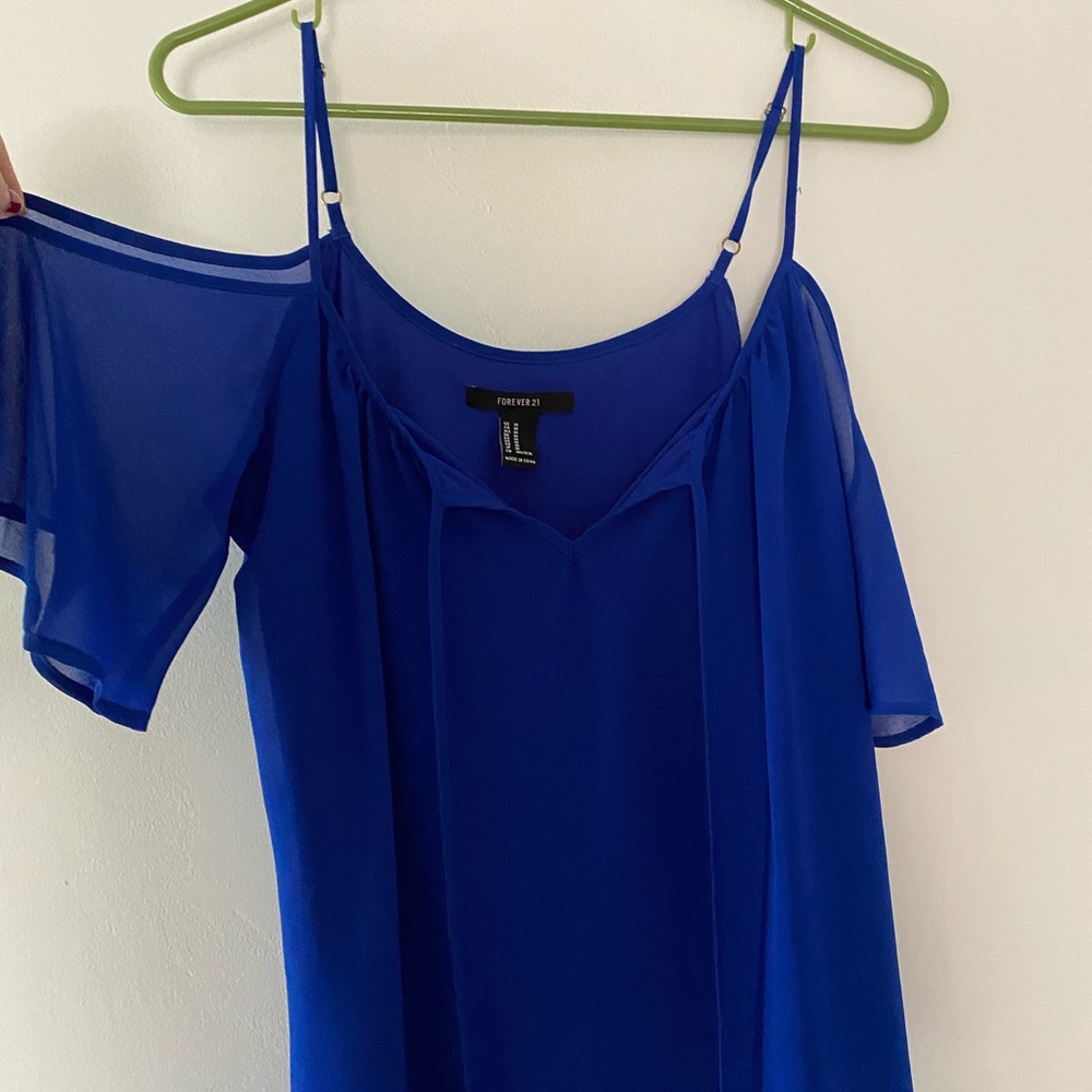 Vibrant blue dress with shoulder openings